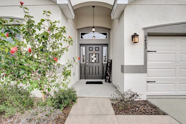 property entrance featuring a garage