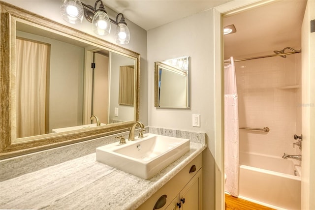 bathroom featuring vanity and shower / bath combo