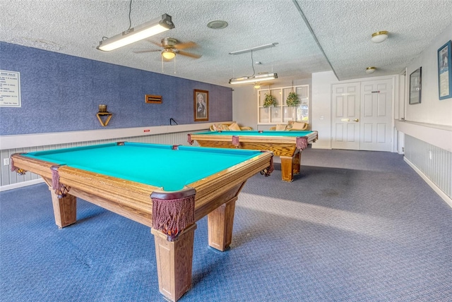 rec room featuring ceiling fan, dark carpet, a textured ceiling, and billiards