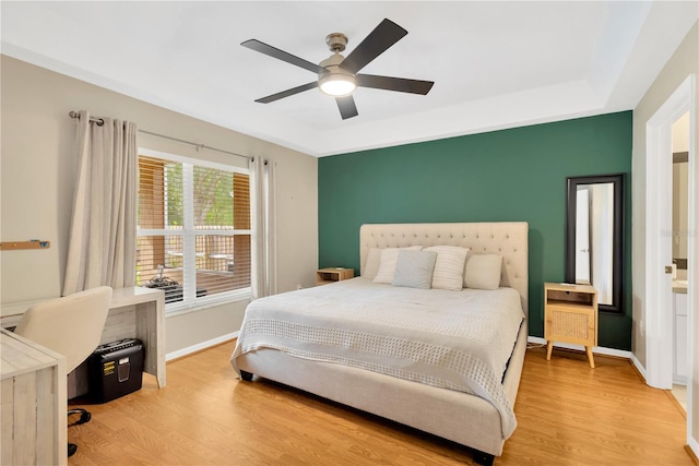 bedroom with ceiling fan and light hardwood / wood-style flooring