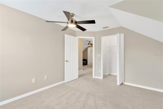 bonus room with light carpet, ceiling fan, and vaulted ceiling