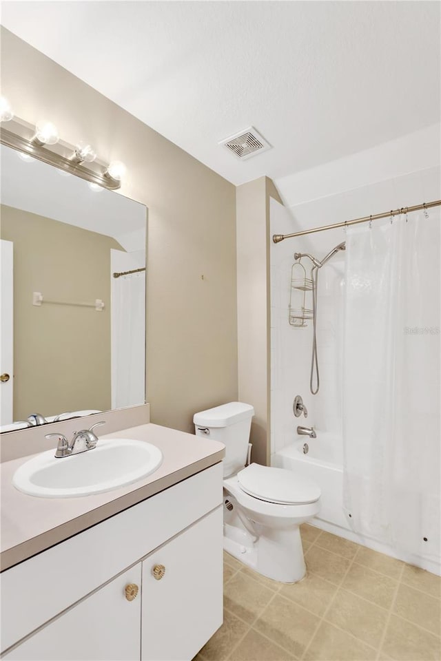 full bathroom with vanity, shower / bath combination with curtain, and toilet