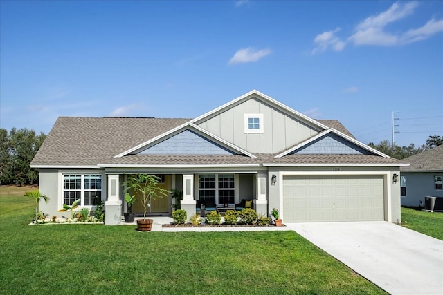 craftsman-style house with a front lawn, a garage, and a porch