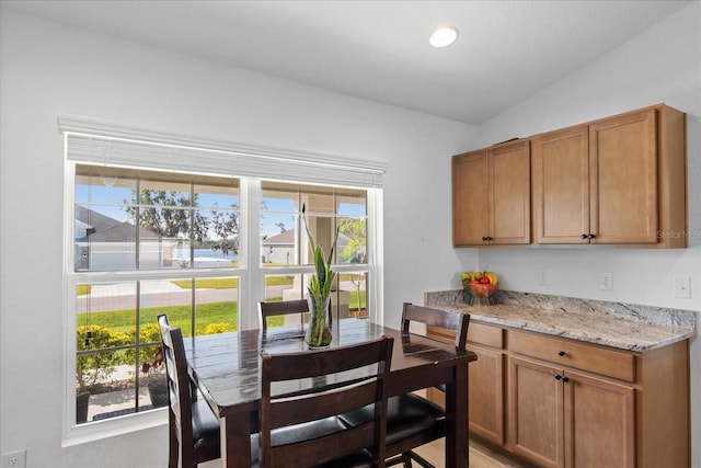 dining space with lofted ceiling