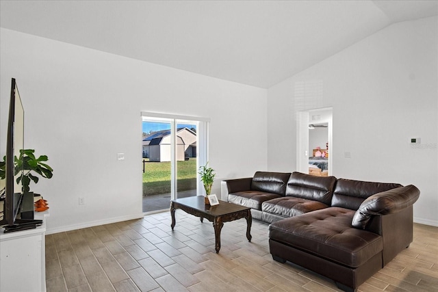 living room featuring vaulted ceiling