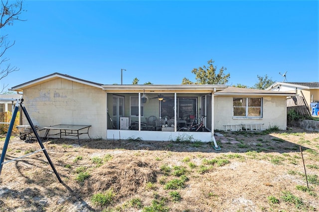 back of property featuring a sunroom