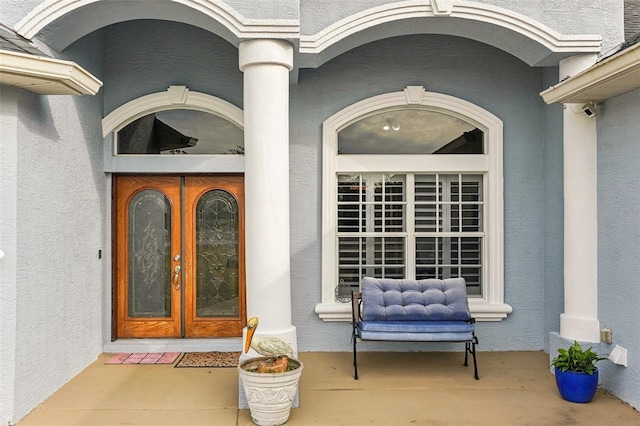 entrance to property featuring french doors