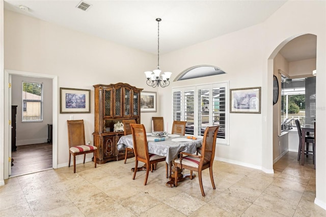 dining room with a notable chandelier