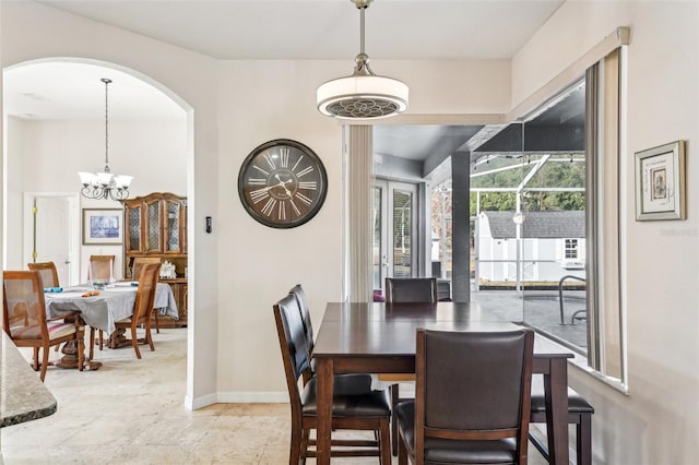 dining room with a notable chandelier