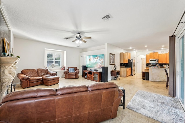 living room with ceiling fan