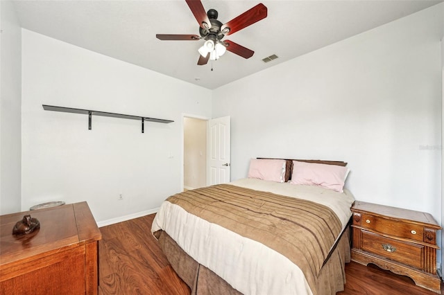 bedroom featuring ceiling fan and dark hardwood / wood-style floors