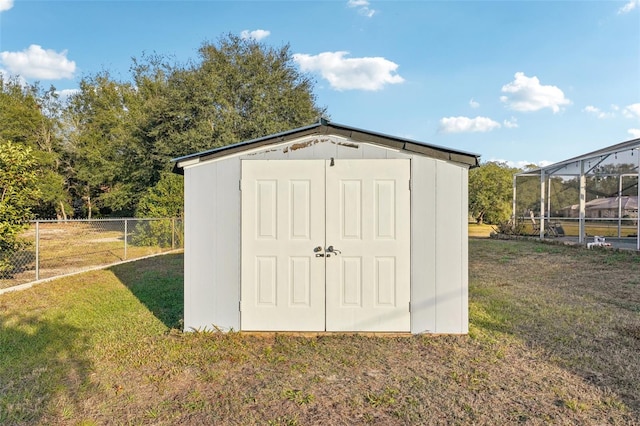 view of outdoor structure featuring a yard