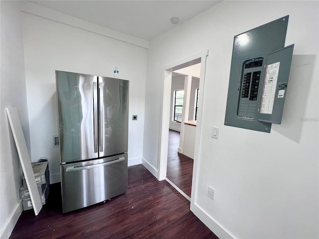 kitchen featuring electric panel, stainless steel refrigerator, and dark wood-type flooring