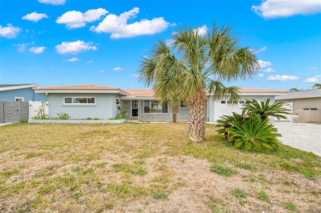 view of front of house with a garage and a front yard