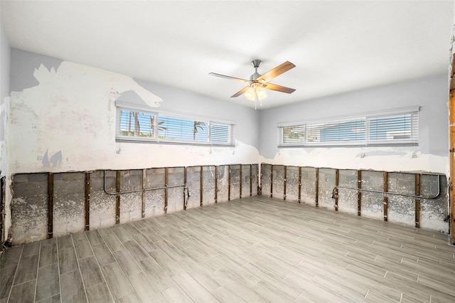 interior space with ceiling fan and light hardwood / wood-style floors