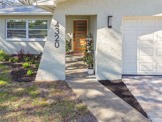 entrance to property featuring a garage