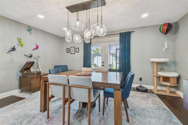 dining room featuring wood-type flooring and french doors