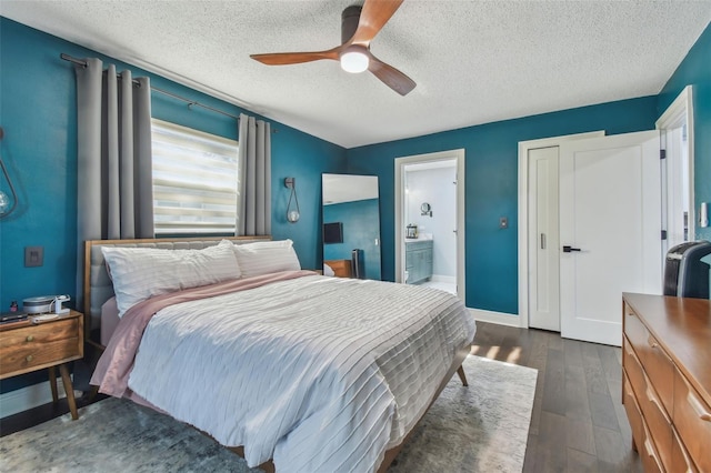 bedroom featuring a textured ceiling, dark hardwood / wood-style flooring, ensuite bath, and ceiling fan