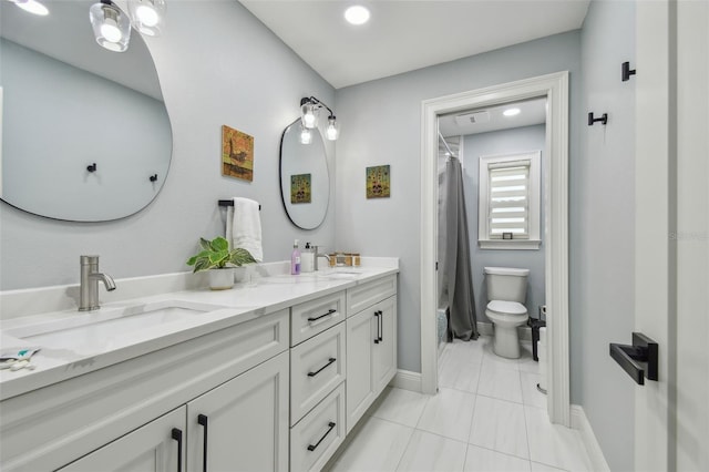 bathroom featuring a shower with shower curtain, vanity, and toilet