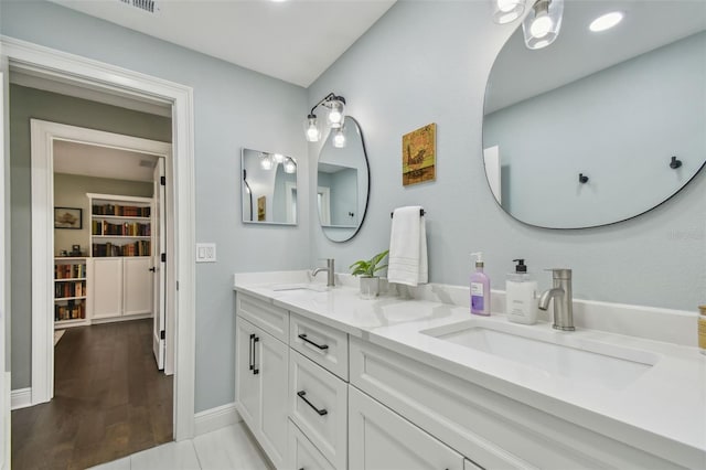 bathroom featuring tile patterned flooring and vanity