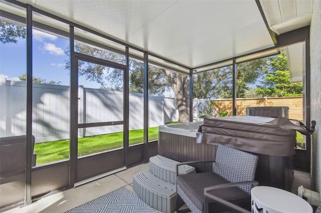 sunroom / solarium featuring a jacuzzi