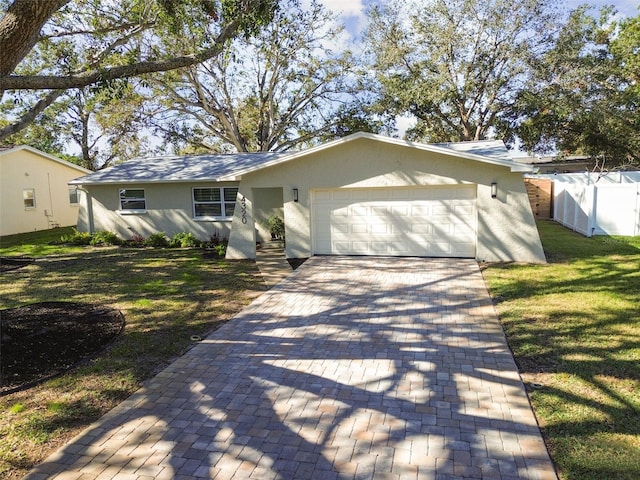 ranch-style house with a front yard and a garage