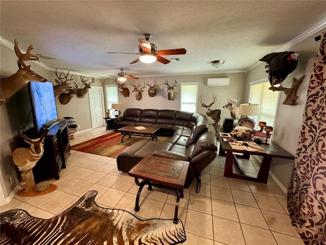 tiled living room with an AC wall unit, crown molding, ceiling fan, and a textured ceiling