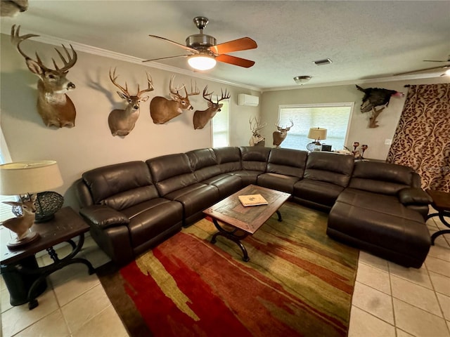 living room with tile patterned flooring, ornamental molding, a textured ceiling, and an AC wall unit