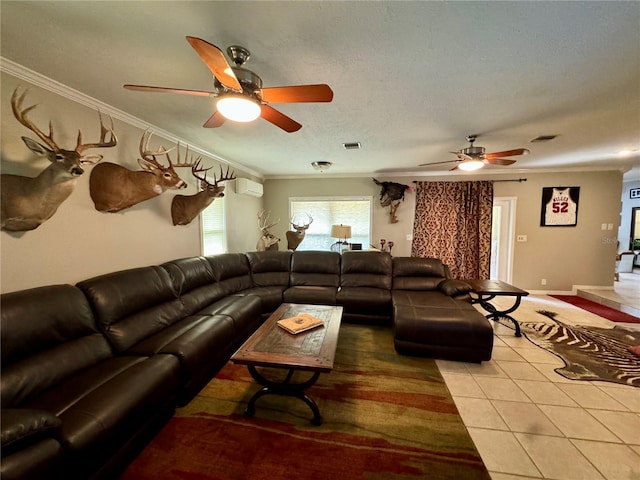 living room with tile patterned floors, crown molding, a textured ceiling, and an AC wall unit