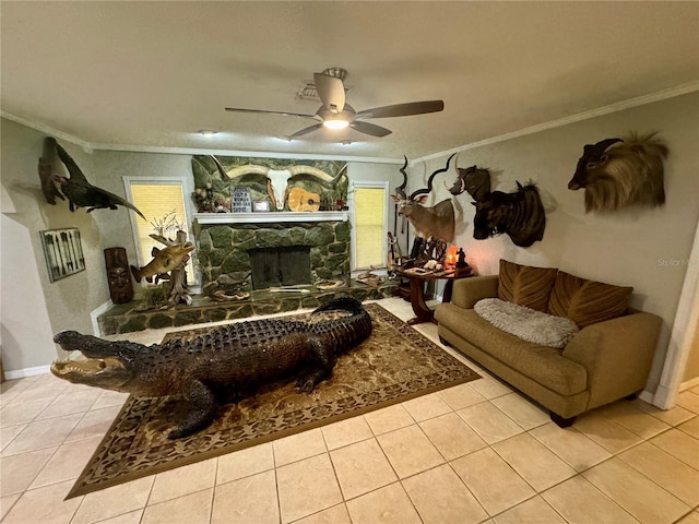 living room featuring light tile patterned floors, a stone fireplace, and crown molding