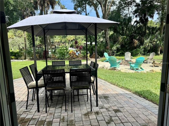 view of patio / terrace with an outdoor fire pit