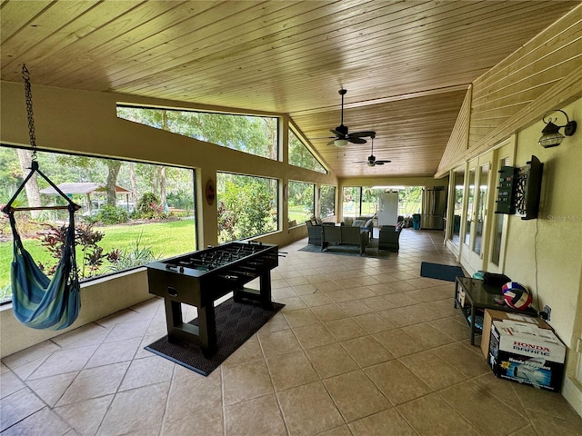 playroom with light tile patterned floors, ceiling fan, lofted ceiling, and wood ceiling