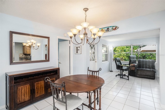 dining area featuring light tile patterned flooring, a textured ceiling, and a chandelier