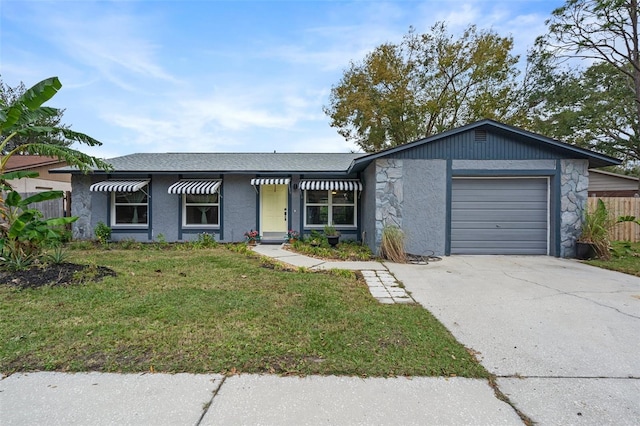 ranch-style home featuring a garage and a front lawn