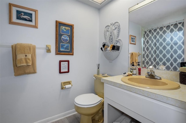 bathroom featuring vanity and toilet