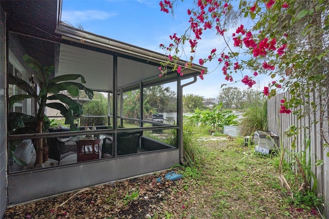 view of yard with a sunroom