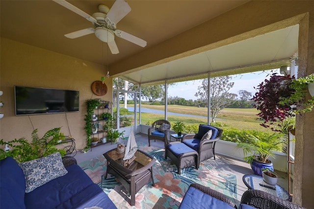 sunroom featuring ceiling fan