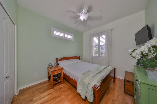 bedroom featuring a closet, ceiling fan, and light hardwood / wood-style floors