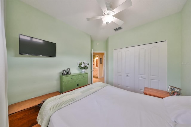 bedroom with ceiling fan and a closet