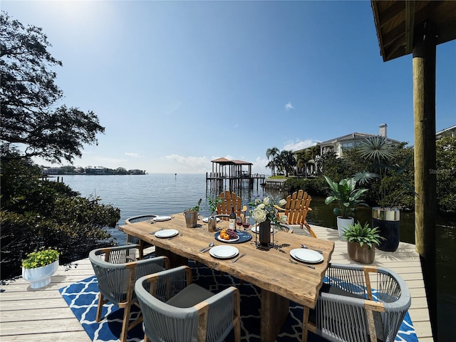 wooden deck featuring a water view