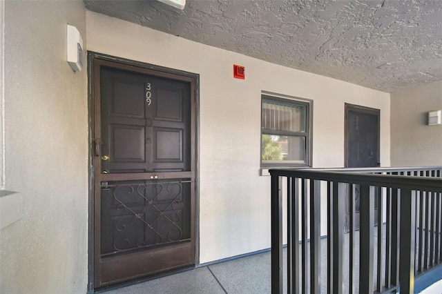 property entrance with a balcony