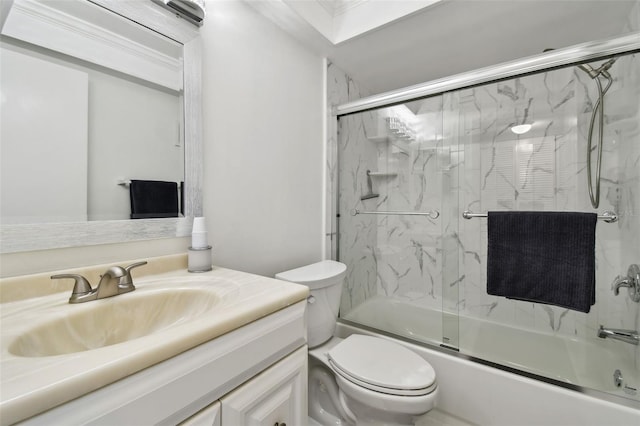 full bathroom featuring shower / bath combination with glass door, vanity, and toilet