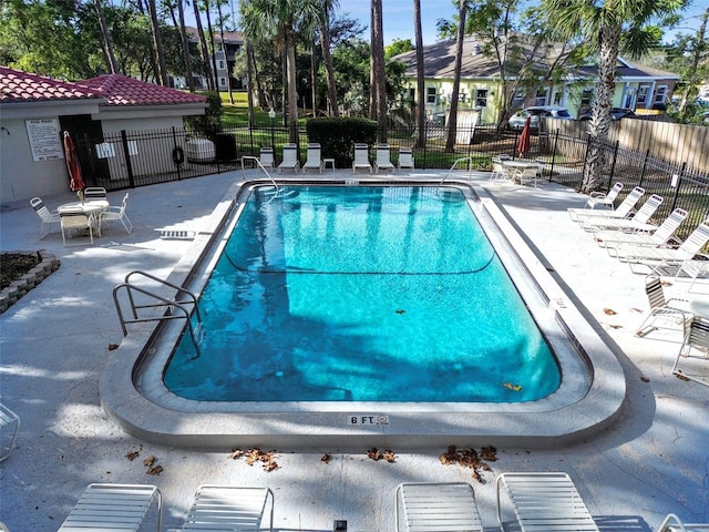 view of swimming pool with a patio