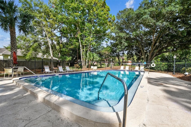 view of swimming pool with a patio area