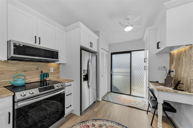 kitchen featuring white cabinets, ceiling fan, light hardwood / wood-style floors, and appliances with stainless steel finishes