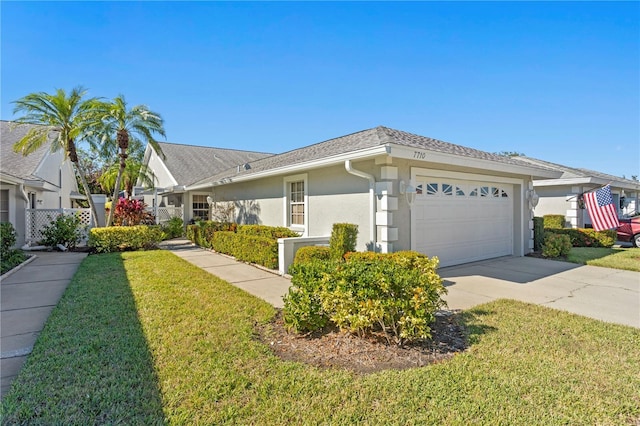 single story home with a garage and a front yard