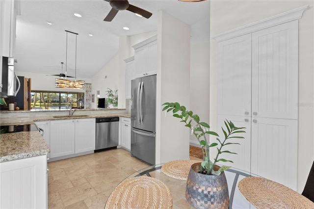 kitchen with white cabinetry, hanging light fixtures, light stone counters, kitchen peninsula, and stainless steel appliances