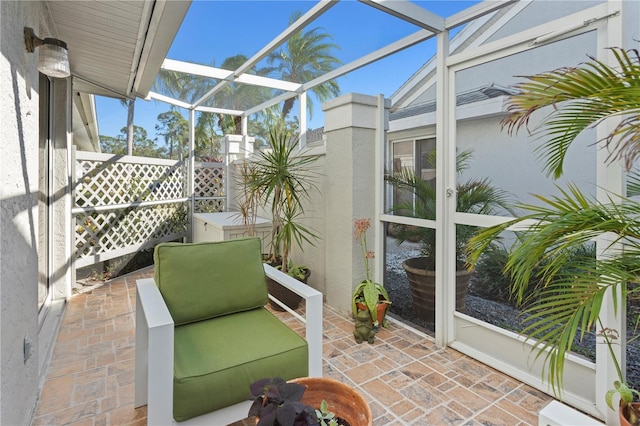 view of patio / terrace with glass enclosure