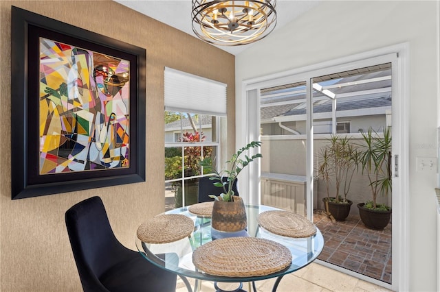 dining space featuring a notable chandelier