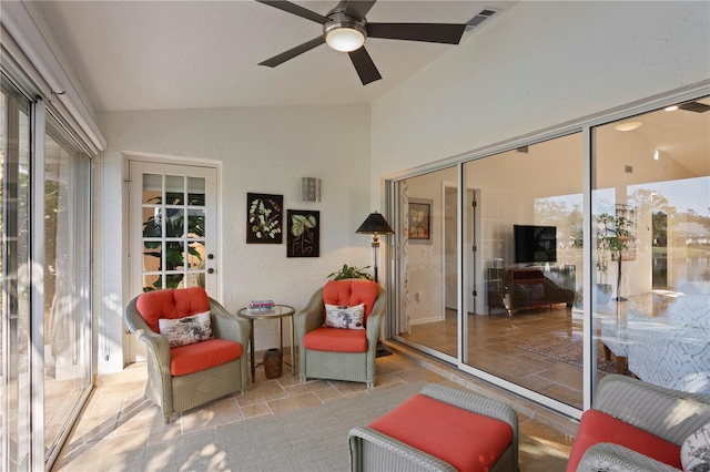 sunroom with vaulted ceiling and ceiling fan